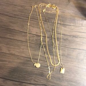 Set of four Madewell gold necklaces
